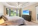 Inviting bedroom with tray ceiling, large windows, and a comfortable bed at 2185 Creole Cir, Cumming, GA 30040