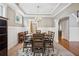 Elegant dining room features a chandelier, wainscoting, and seating for six at 2185 Creole Cir, Cumming, GA 30040