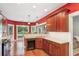 Stylish kitchen featuring granite countertops, modern appliances, and hardwood floors at 2185 Creole Cir, Cumming, GA 30040