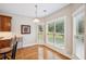 Cozy breakfast nook with natural light, wood floors and backyard views at 2185 Creole Cir, Cumming, GA 30040