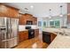 Modern kitchen with granite countertops, stainless steel appliances, and hardwood flooring at 2185 Creole Cir, Cumming, GA 30040