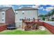 Large backyard with deck, stairs, and trampoline, perfect for outdoor living and entertaining at 2425 Delamore Chase, Duluth, GA 30097