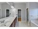 Bathroom featuring a dual vanity, bright lighting, and tile floors at 2425 Delamore Chase, Duluth, GA 30097