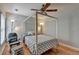 Bedroom features hardwood floors and a ceiling fan at 2425 Delamore Chase, Duluth, GA 30097
