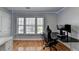 Bedroom includes a desk and chair plus a large window at 2425 Delamore Chase, Duluth, GA 30097