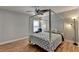 Bedroom features hardwood floors and a ceiling fan at 2425 Delamore Chase, Duluth, GA 30097