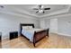 Bedroom featuring a ceiling fan, light gray walls, and plenty of natural light at 2425 Delamore Chase, Duluth, GA 30097