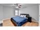 Bedroom features a ceiling fan and window providing natural light at 2425 Delamore Chase, Duluth, GA 30097