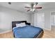 Bedroom features hardwood floors and a ceiling fan at 2425 Delamore Chase, Duluth, GA 30097