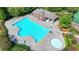 A bright blue pool and a tan pool-house surrounded by neatly manicured green lawns at 2425 Delamore Chase, Duluth, GA 30097