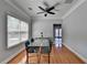 Bright dining area featuring hardwood floors, modern light fixture and view to the outside at 2425 Delamore Chase, Duluth, GA 30097