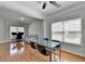 Open-concept dining area featuring hardwood floors and view to the living room at 2425 Delamore Chase, Duluth, GA 30097