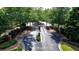Gated community entrance surrounded by lush trees and landscaping at 2425 Delamore Chase, Duluth, GA 30097