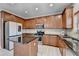 Spacious kitchen featuring a central island, stainless steel appliances and modern fixtures at 2425 Delamore Chase, Duluth, GA 30097