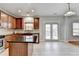 Well-equipped kitchen boasting stainless steel appliances, granite countertops, and a door to the backyard at 2425 Delamore Chase, Duluth, GA 30097
