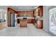 Well-lit kitchen with stainless steel appliances, granite counters, and a functional kitchen island at 2425 Delamore Chase, Duluth, GA 30097