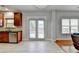 Bright kitchen with stainless steel appliances and access to outdoor deck through French doors at 2425 Delamore Chase, Duluth, GA 30097