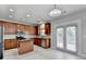 Eat-in kitchen with recessed lighting, stainless appliances, and access to the deck through French doors at 2425 Delamore Chase, Duluth, GA 30097