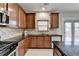 Modern kitchen with wood cabinets, stainless appliances, granite countertops and tile backsplash at 2425 Delamore Chase, Duluth, GA 30097