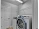 Laundry room features new washing machine and dryer units at 2425 Delamore Chase, Duluth, GA 30097