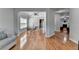 Open-concept living and dining area with hardwood floors and ample natural light at 2425 Delamore Chase, Duluth, GA 30097