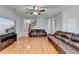 Open-concept living room featuring staircase, fireplace, and lots of seating at 2425 Delamore Chase, Duluth, GA 30097