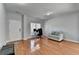 Cozy living room with hardwood floors, a large window, and comfortable seating at 2425 Delamore Chase, Duluth, GA 30097