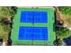 Aerial view of community tennis courts featuring a blue surface and green trim at 2425 Delamore Chase, Duluth, GA 30097
