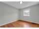 Neutral bedroom with hardwood floors and window at 3395 Spring Dr, Atlanta, GA 30360