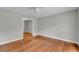 Empty bedroom featuring hardwood floors, neutral walls, and a ceiling fan at 3395 Spring Dr, Atlanta, GA 30360