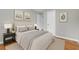 Bedroom with neutral tones, hardwood floors, and tasteful decor at 3395 Spring Dr, Atlanta, GA 30360