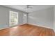 Empty bedroom featuring hardwood floors, neutral walls, and a ceiling fan at 3395 Spring Dr, Atlanta, GA 30360