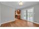 Dining room featuring hardwood floors, neutral walls, and a view of the kitchen at 3395 Spring Dr, Atlanta, GA 30360