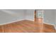 Living room featuring hardwood floors, neutral walls, and a view of the kitchen at 3395 Spring Dr, Atlanta, GA 30360