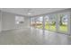 Spacious living room with tile floors, large windows and backyard views at 3395 Spring Dr, Atlanta, GA 30360