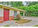 Property with a brick foundation, cream siding, front door, and convenient carport, perfect for easy access at 3395 Spring Dr, Atlanta, GA 30360
