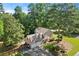 Aerial shot of a home featuring a two-car garage, mature trees, and large back yard at 3999 Brintons Ml, Marietta, GA 30062