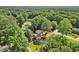 Aerial view of a neighborhood featuring mature trees, landscaped lawns, and sidewalks at 3999 Brintons Ml, Marietta, GA 30062
