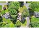 Aerial view of the house with mature trees on a cul-de-sac lot, featuring brick patio and extended driveway at 3999 Brintons Ml, Marietta, GA 30062