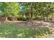 Expansive backyard with lush green grass and mature trees, ideal for outdoor activities and relaxation at 3999 Brintons Ml, Marietta, GA 30062