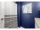 Nautical-themed bathroom with blue walls, patterned shower curtain, and granite countertop at 3999 Brintons Ml, Marietta, GA 30062