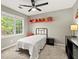This bedroom features a ceiling fan, a bed, and a red shelf above it at 3999 Brintons Ml, Marietta, GA 30062