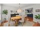Bright dining room boasts a wooden table, stylish chairs, and access to the kitchen at 3999 Brintons Ml, Marietta, GA 30062
