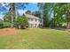 Classic brick home with blue shutters, a well-kept lawn, and mature trees providing shade and curb appeal at 3999 Brintons Ml, Marietta, GA 30062