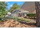 The house sits adjacent to the 2 car garage and extra parking space, framed by lush landscaping at 3999 Brintons Ml, Marietta, GA 30062