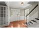 Welcoming foyer featuring wood floors, a staircase, and white trim at 3999 Brintons Ml, Marietta, GA 30062