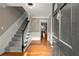 Elegant foyer with hardwood floors, a staircase, and an open doorway at 3999 Brintons Ml, Marietta, GA 30062