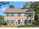 Brick two story house with blue shutters and a well maintained lawn and landscaping at 3999 Brintons Ml, Marietta, GA 30062