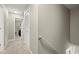 Well-lit hallway with a staircase and access to bedrooms, providing a seamless transition between living spaces at 3999 Brintons Ml, Marietta, GA 30062