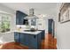 Stylish eat-in kitchen featuring navy cabinets, stainless appliances, and quartz countertops at 3999 Brintons Ml, Marietta, GA 30062